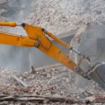 Demolition,Of,Building.,Excavator,Breaks,Old,House.,Freeing,Up,Space