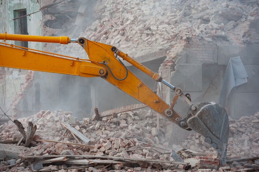Demolition,Of,Building.,Excavator,Breaks,Old,House.,Freeing,Up,Space