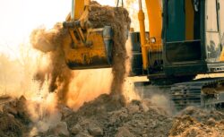 Close-up,Of,Excavator,At,Construction,Site.,Backhoe,Digging,Soil,For