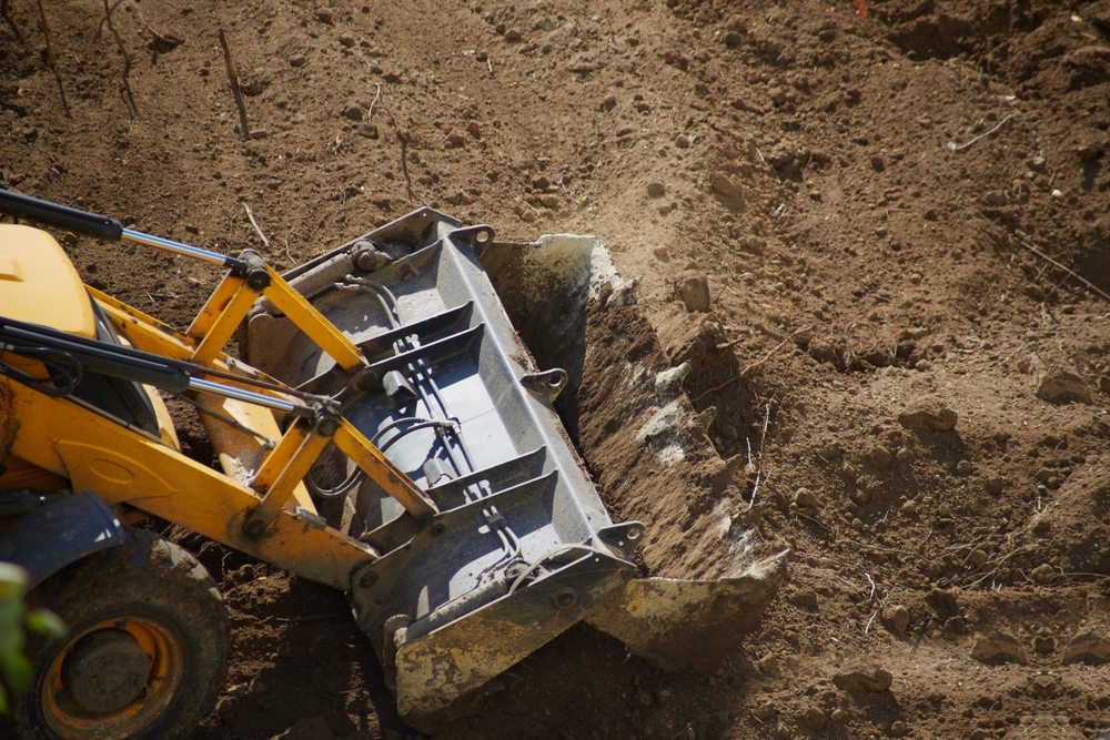 Bulldozer,Bucket,Leveling,The,Ground,,Bulldozer,Bucket,Ground,Leveling,,Close-up