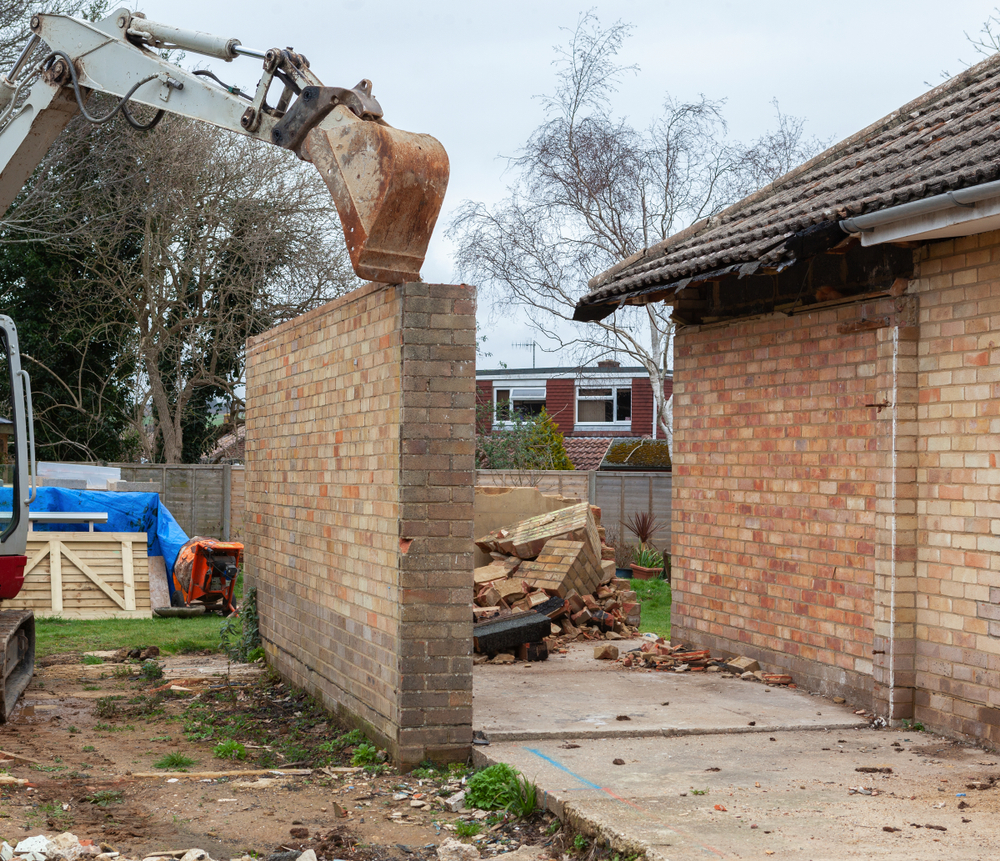 Demolition,Of,The,Garage,In,The,Garden,,Excavator,,Selective,Focus